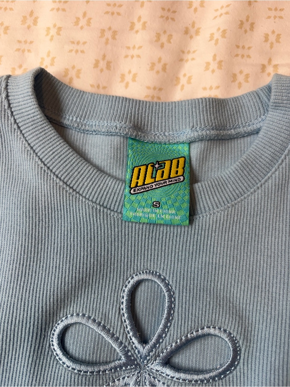Zumiez Light Blue Long Sleeve Cropped Top with Flower Cutout - Picture 5 of 5